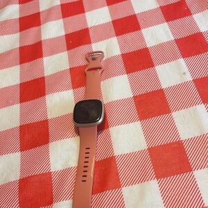 Fitbit Pink and Black Smartwatch with Modern Design good condition